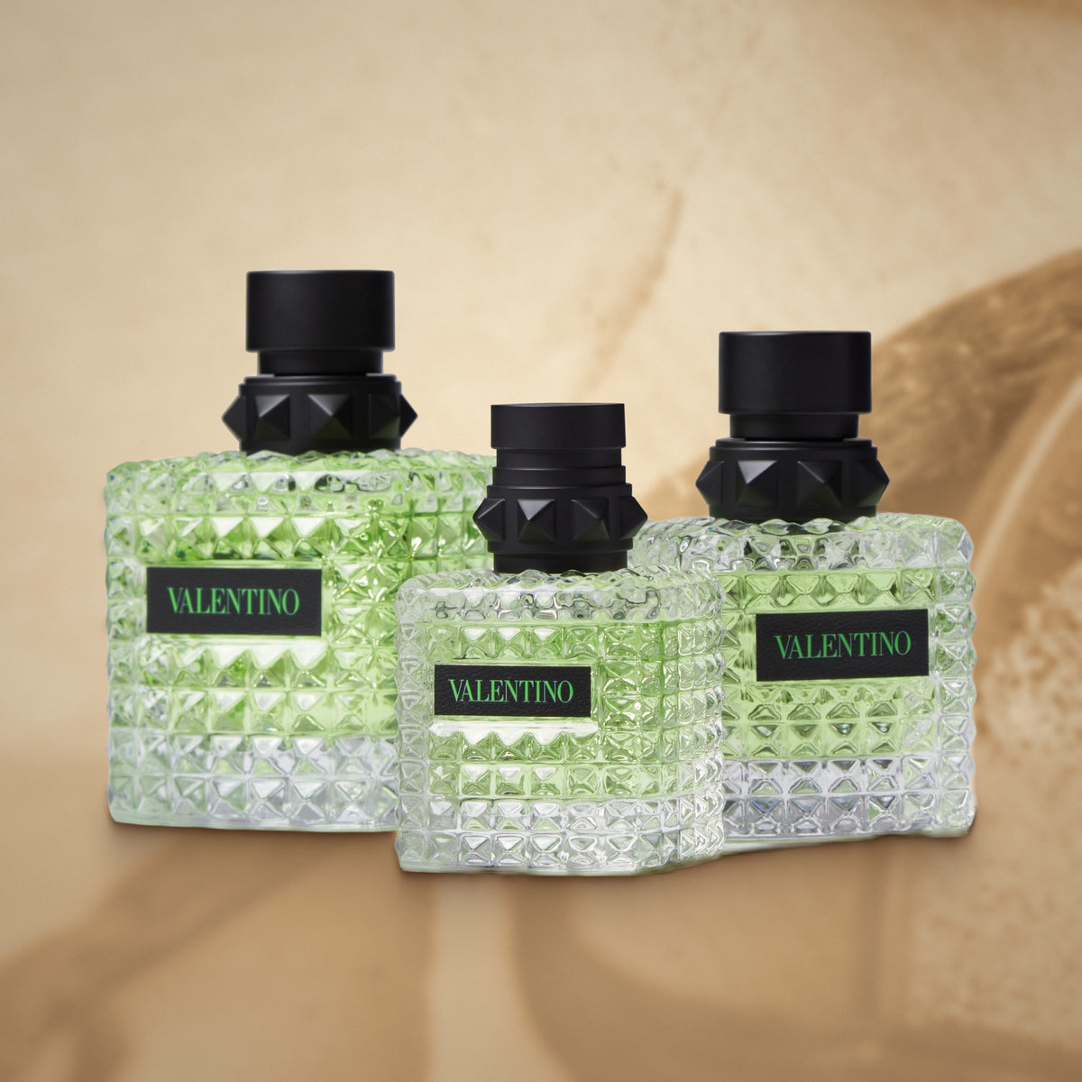 Valentino Born in Roma Green Stravaganza bottle collection on a warm creamy vanilla background
